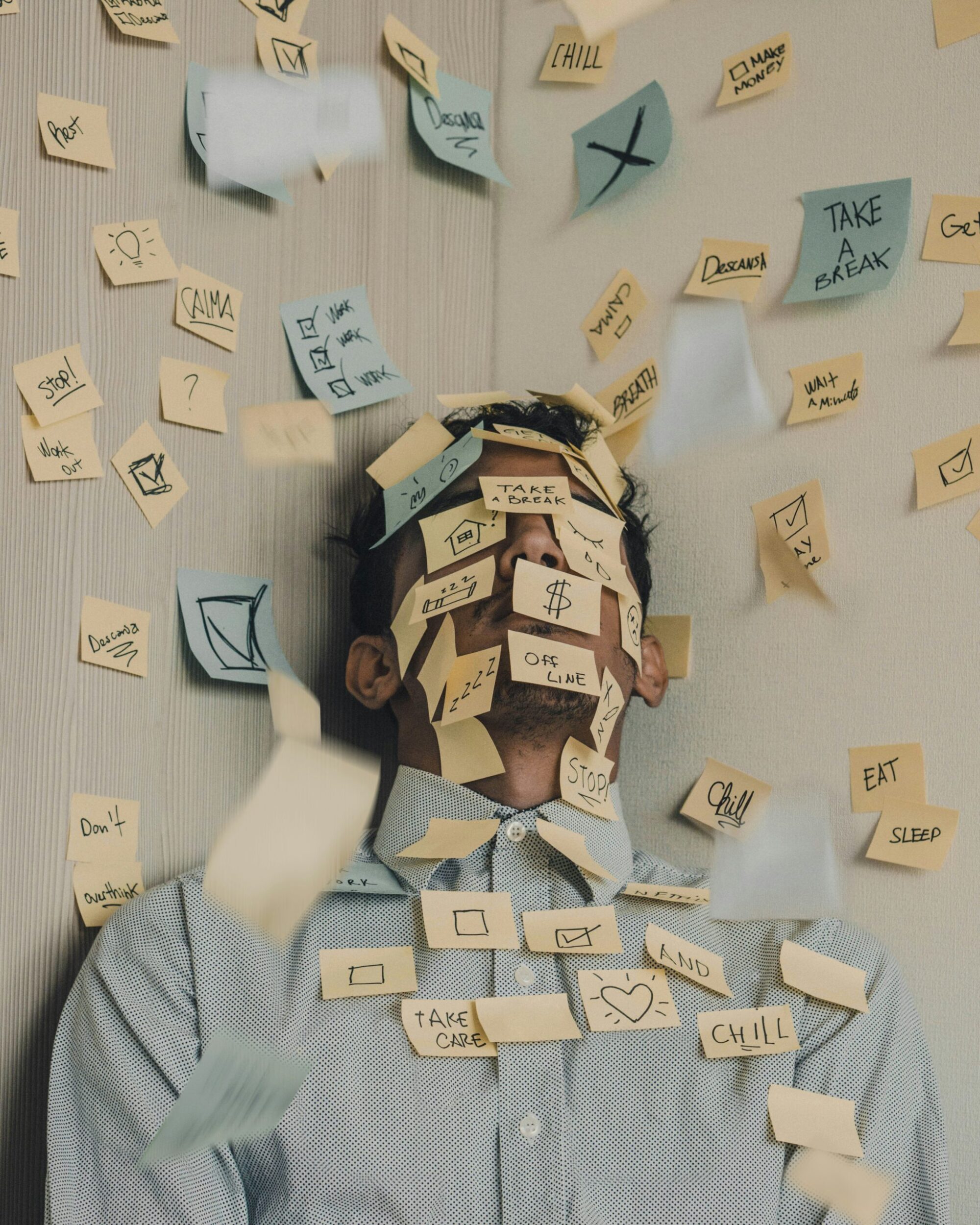 Business owner covered in sticky notes